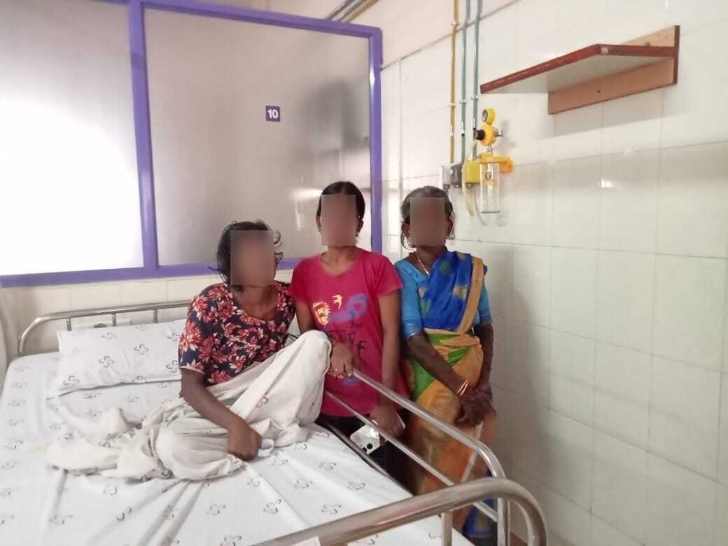 Patient Malliga with family members in hospital room